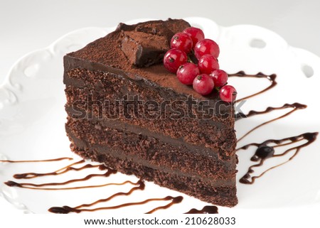 Chocolate layer cake with red currants and chocolate