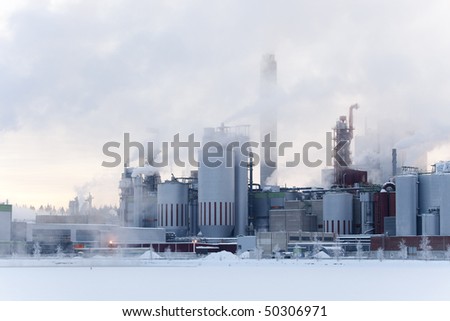 Paper factory in a snowy and icy winter.