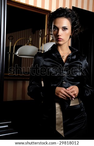 Elegant woman pictured in the neat interior.