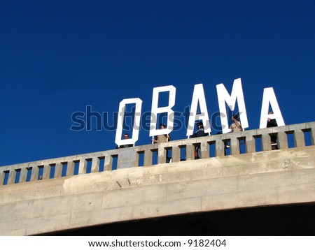 Supporters for Democratic Presidential candidate Barack Obama try to get out the vote over morning commuter traffic on the 101 freeway in Los Angeles, CA on Super Tuesday, February 5, 2008.
