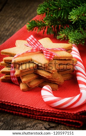 Christmas gingerbread cookies and candy cane on red napkin