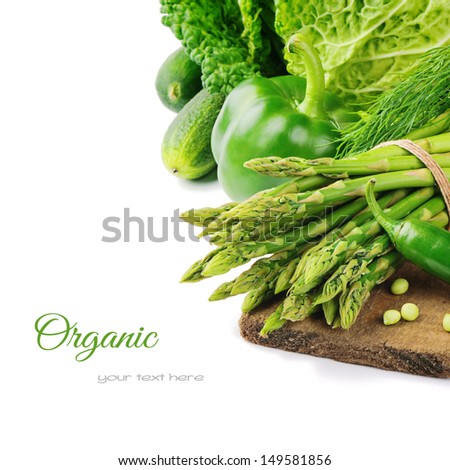 Fresh green vegetables on wooden cutting board