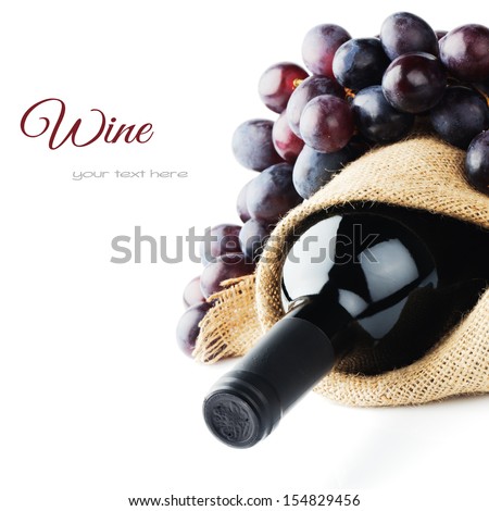 Bottle Of Red Wine And Freshly Harvested Grape