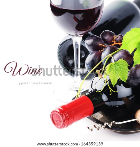 Bottles Of Red Wine With Fresh Grape Isolated Over White