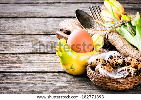 Rustic table setting with quail eggs for Easter holiday