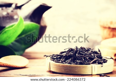 Closeup of black tea and teapot. Health and diet concept