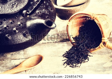 Closeup of black tea and teapot. Health and diet concept