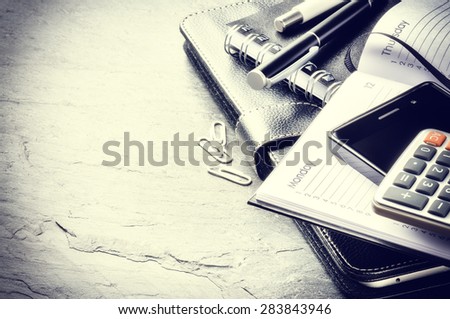 Business concept with agenda, mobile phone and calculator. Copy space