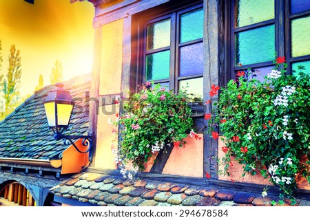 Details of traditional timber frame house at sunset. Alsace, France