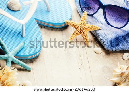 Summer holiday setting with flip flops and beach wear. Copy space