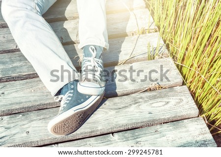 Summer landscape with relaxing teenager. Copy space