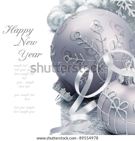 Christmas balls on the festive silver background