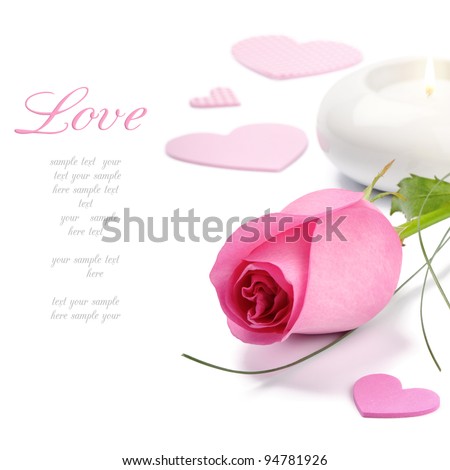 Pink rose and candle over white