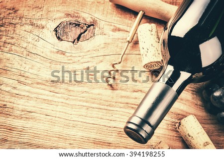 Setting with bottle of red wine and corks. Wine list concept with copy space