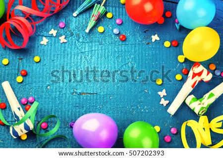 Colorful birthday frame with multicolor party items on dark blue background. Happy birthday concept