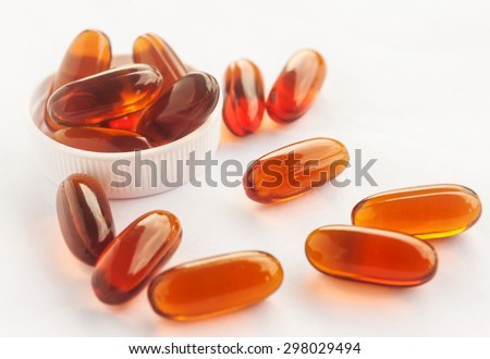 Vitamin in capsule on white, Vitamin for health