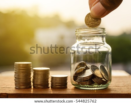 Saving money for prepare concept, Hand with rows of coins and account for finance and banking, Hand with money coin stack growing business