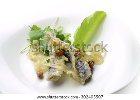 Appetizer of Fish Marinated Anchovies in white plate