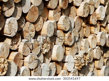 Wood storage with chunks of logs for fireplace