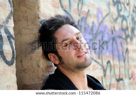 Portrait of happy man in urban background