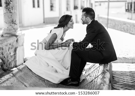 Just married couple together in urban background