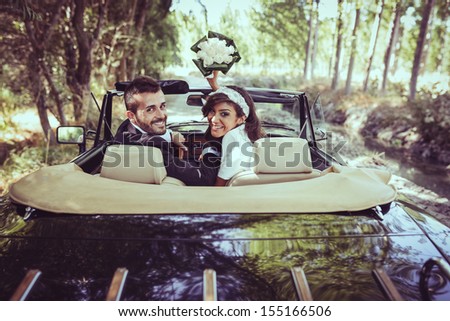 Just Married Couple Together In An Old Car