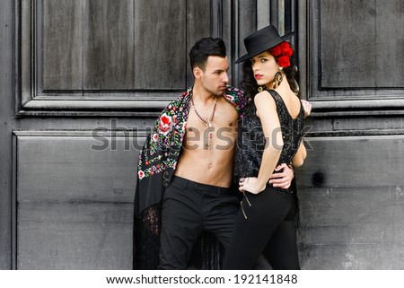 Portrait of beautiful couple, models of fashion, wearing spanish clothes