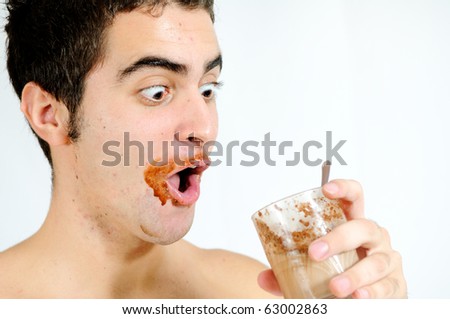 Young guy drinking a chocolat smoothie