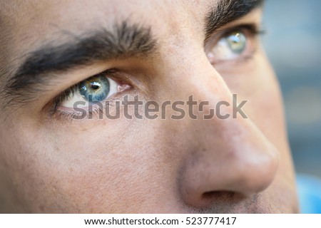 Close-up shot of man\'s eye. Man with blue eyes.