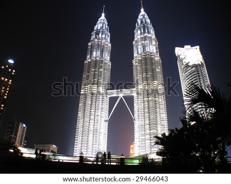 Couple looking at KLCC Twin Towers located in Malaysia KL Couple looking at KLCC Twin Towers located in Malaysia KL
