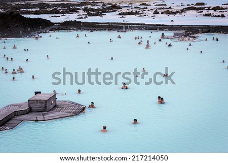 BLUE LAGOON, ICELAND - Aug 26 2014: People bathing in The Blue Lagoon, a geothermal bath resort in the south of Iceland, near Reykjavik. August 26, 2014 in Iceland.