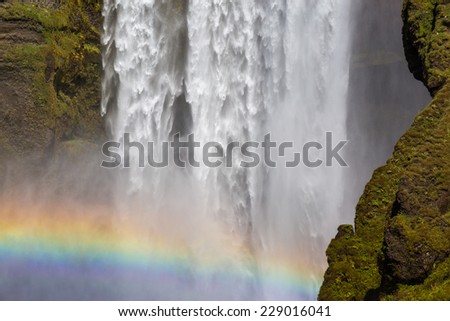 Skogafoss Waterfall in Iceland, close up on the fall with rainbow