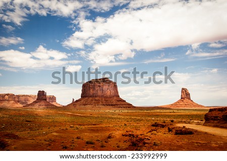 Monument Valley Navajo Tribal Park, mittens and clouds in the blue sky. American Landscape, natural wonder