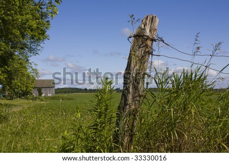 Farmland and fence post
