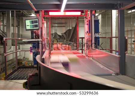 Packages being scanned and distributed on conveyor belt