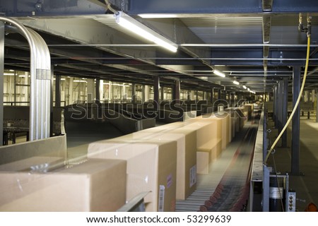 Packages distributed on conveyor belt on automated system