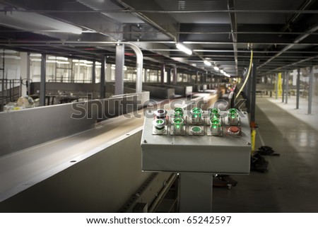 Control panel of automated machine sorting packages for delivery