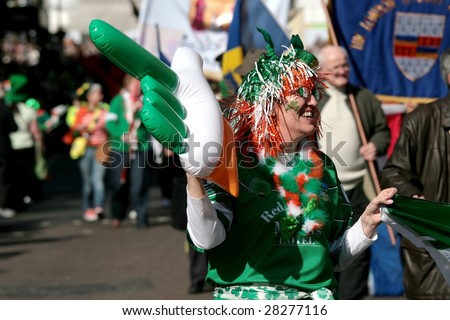 LONDON - MARCH 15: Irish people parade on the street during St Patrick\'s Day parade March 15, 2009 in London, England