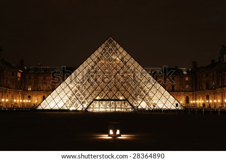 PARIS - MARCH 14: Museum du Louvre and the Pyramid night view March 14, 2006 in Paris France