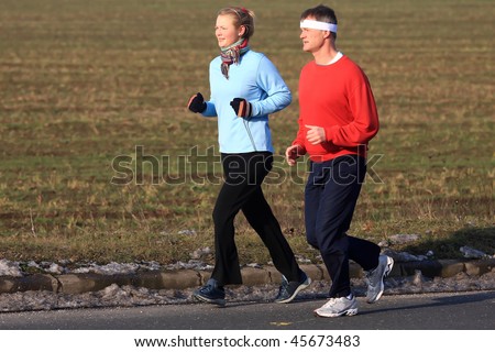 Two running in the cold winter weather
