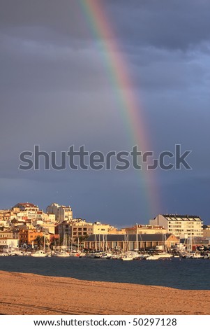 A beautiful beach picture , rainbow after the storm