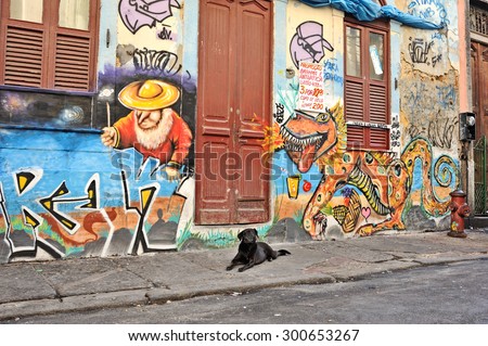 Rio de Janeiro, Brazil - September 8, 2013: Street art and black dog at Joaquim Silva street in Lapa, Rio de Janeiro downtown area