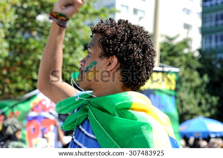Copacabana beach, Rio de Janeiro, Brazil - August 16, 2015: Young Brazilian says \'no\' to political corruption and impunity.