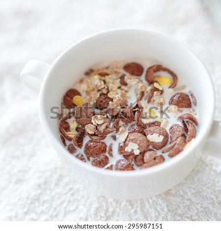 cereal with milk in white cup