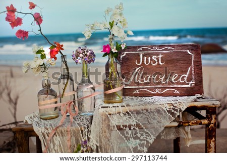 It is written on the label the word love flowers ocean water bottle wedding happiness romance