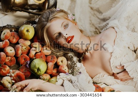 Blond woman Retro Style Image Black and white profile portrait of young beautiful woman with blond hair and fruits and flowers