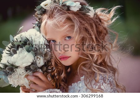 cute little bridesmaid with bunch of flowers wedding concept  cute princess girl Happy little schoolgirl with flowers. Back to school outdoor