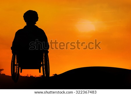 behind disabled woman on wheelchair
