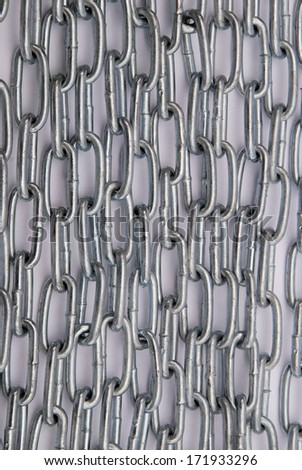 Metal chain folded in a row. natural shade