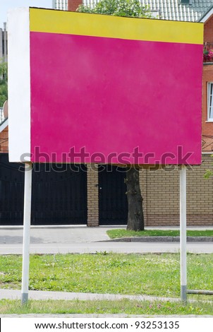 Red billboard. On a background of a house